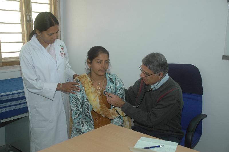 DSC_0212.JPG - Dr. Paresh examining  a pateint