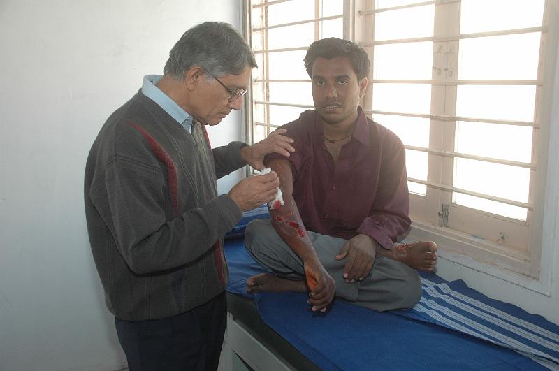 DSC_0220.JPG - Dr. Paresh examining  a pateint