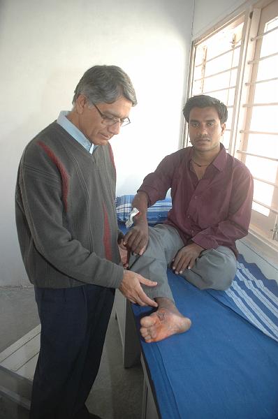 DSC_0221.JPG - Dr. Paresh examining  a pateint